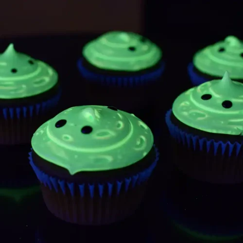 Glow-in-the-Dark Moonlit Cupcakes glow vibrantly under black light.